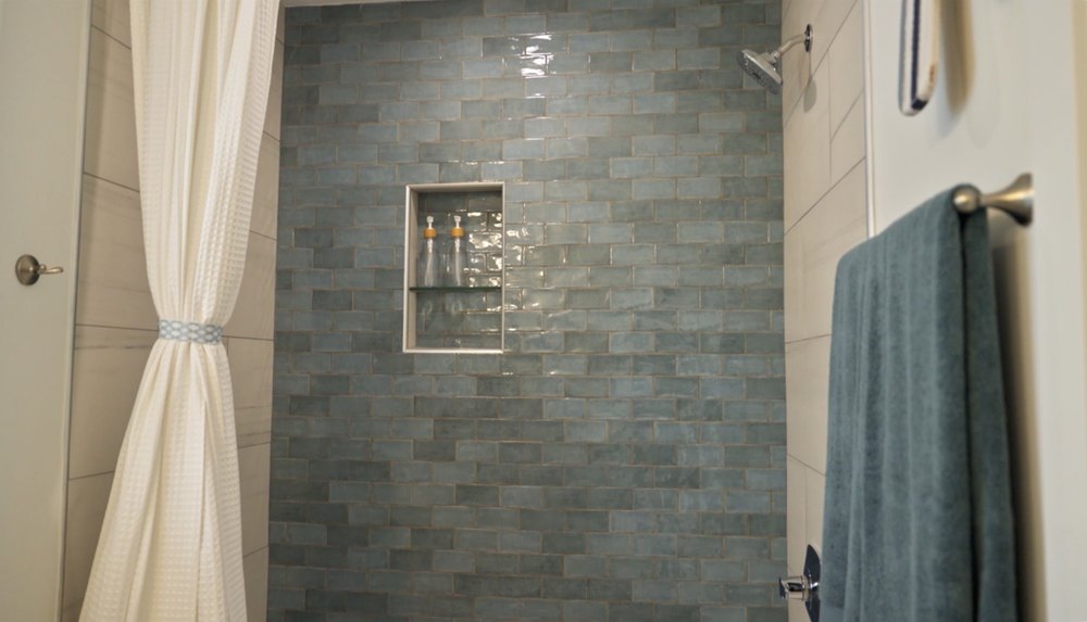 The shower space also boasts a built-in shelf for toiletries.