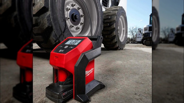 M12 inflator next to Bobcat-style vehicle