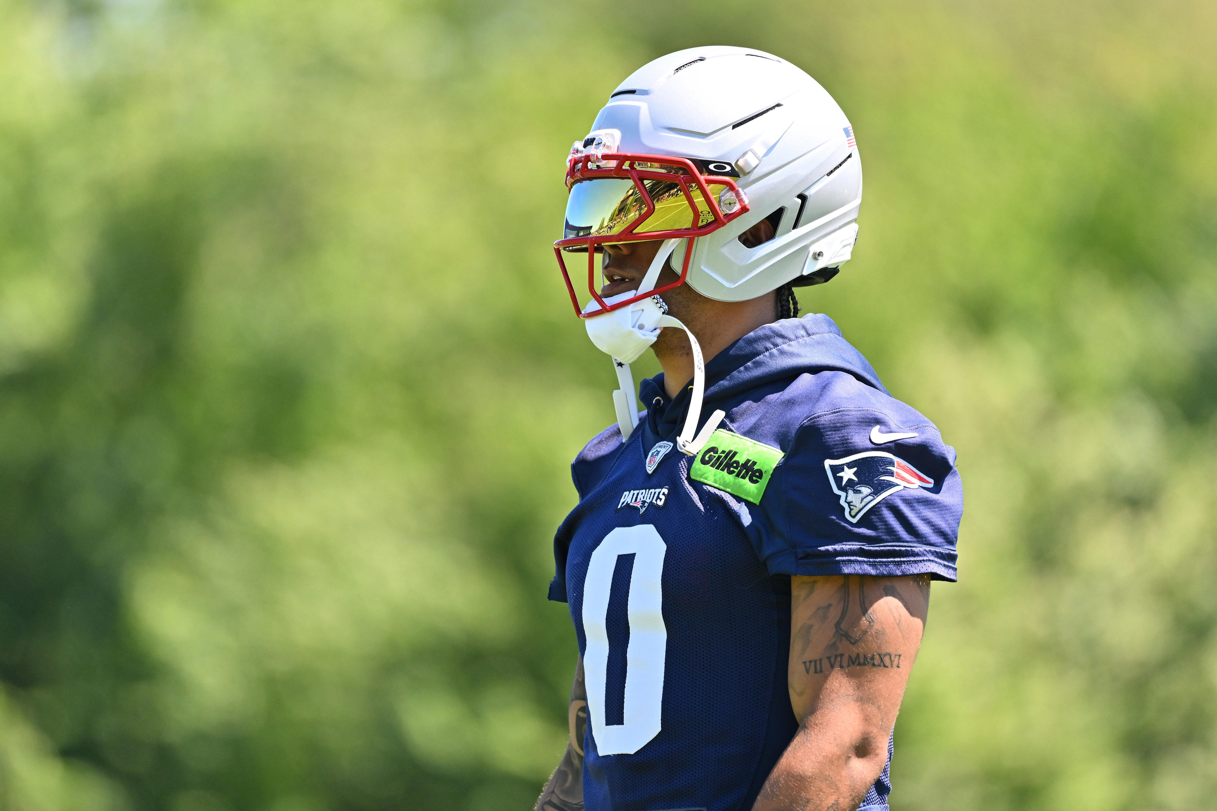 Jun 9, 2026; Foxborough, MA, USA; New England Patriots cornerback Christian Gonzalez (0) looks on during minicamp at Gillette Stadium. Mandatory Credit: Eric Canha-Imagn Images