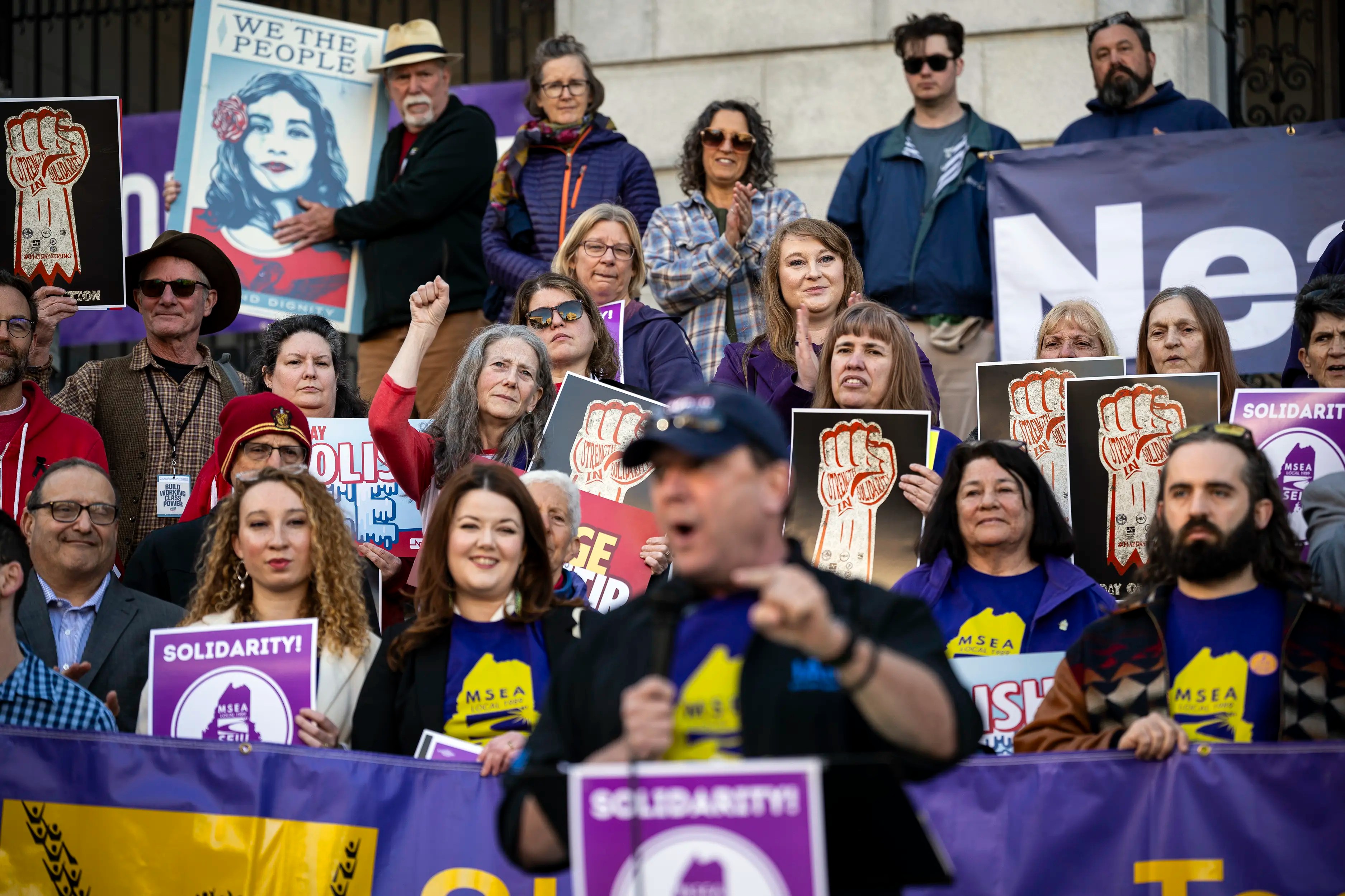 Demonstrators behind Maine candidate for Governor Troy Jackson during a May Day rally on May 1, 2026 outside City Hall in Portland, Maine.