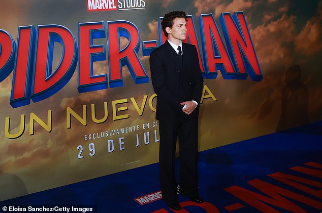 The 30-year-old Englishman kept it simple in a black double-breasted suit, matching necktie accented with a spider pin and dress shoes