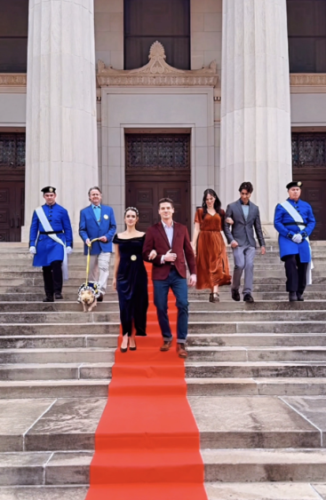 On location in Guthrie, Oklahoma, on the steps of the historic Scottish Rite Temple, which doubled as our fictional palace. May 20, 2026 From left: David Merrick as a Caldenian Royal Guard; John Gibson Miller as King Roman of Calden with Cannon, the royal dog; Alexandra Harris as the princess; Robert Palmer Watkins as her co-lead; Karsten Tate; Jamil Karn; and Joshua Yuen. A full cast and crew list is available on IMDb.