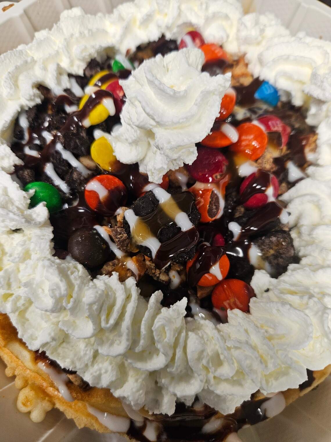 The Candyland Waffle comes topped with M&Ms, Butterfingers, white chocolate and more.