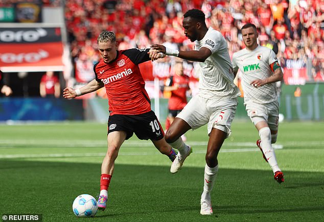 Chrislain Matsima battles with Florian Wirtz before the Leverkusen star's move to Liverpool