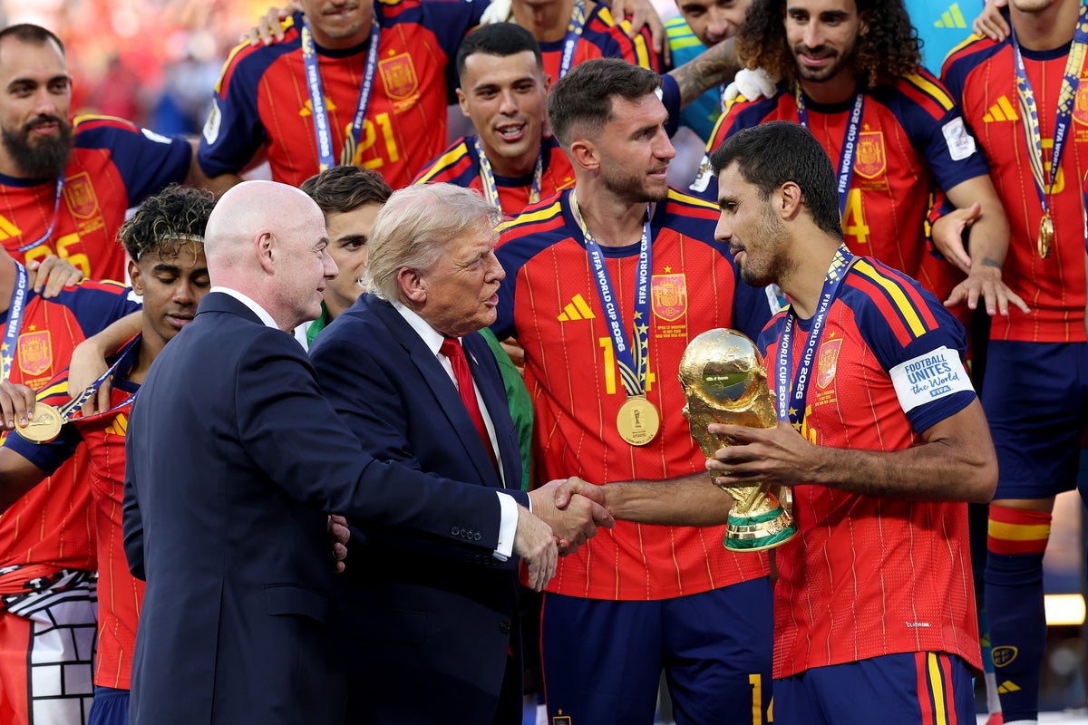 Rodri #16 of Spain is presented the FIFA World Cup Winner’s Trophy by U.S. President Donald Trump and FIFA President Gianni Infantino after the team’s victory following during the FIFA World Cup 2026 Final match between Spain and Argentina at New York New Jersey Stadium on July 19, 2026 in East Rutherford, New Jersey.