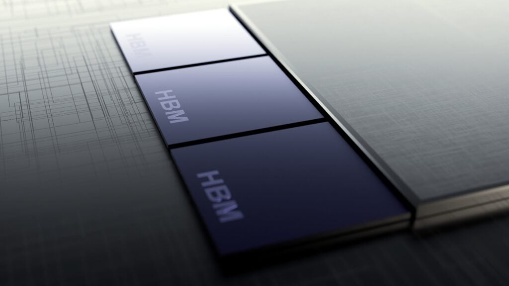 Close-up of three dark HBM memory modules connected to a larger gray component on a circuit board.