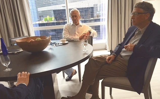 Epstein (left) and Mr Gates (right) during an apparent meeting. It is unclear when the photo was taken