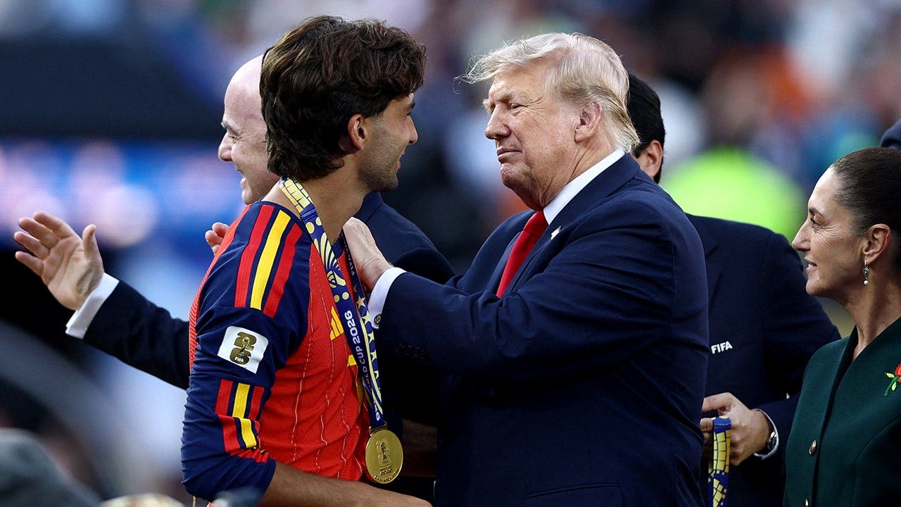 Ferran Torres receives his winners medal from President Donald Trump during the FIFA World Cup 2026 final trophy ceremony.
