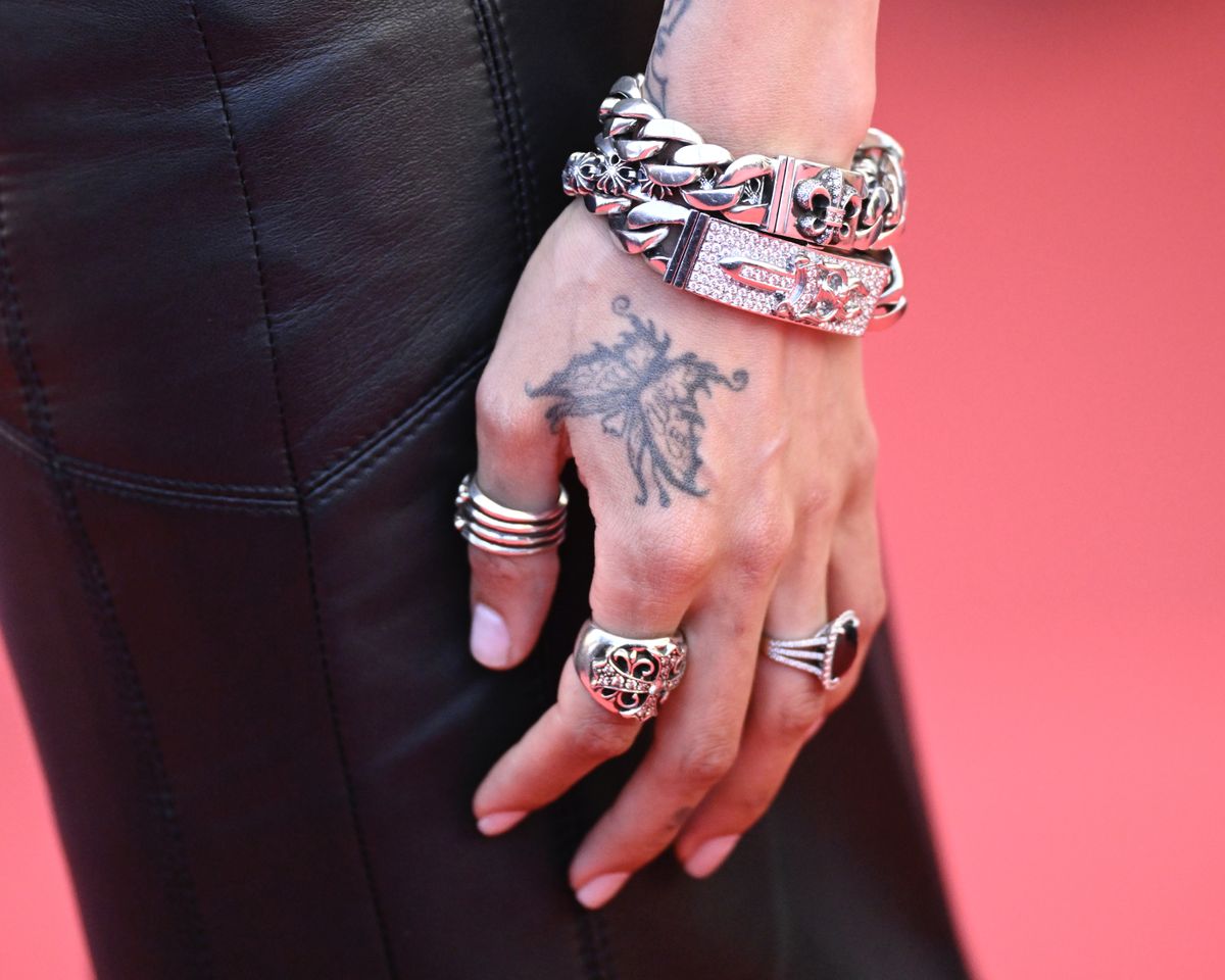 Gabriella Bechtel aka Gabbriette, jewelry and tattoo detail, attends the
