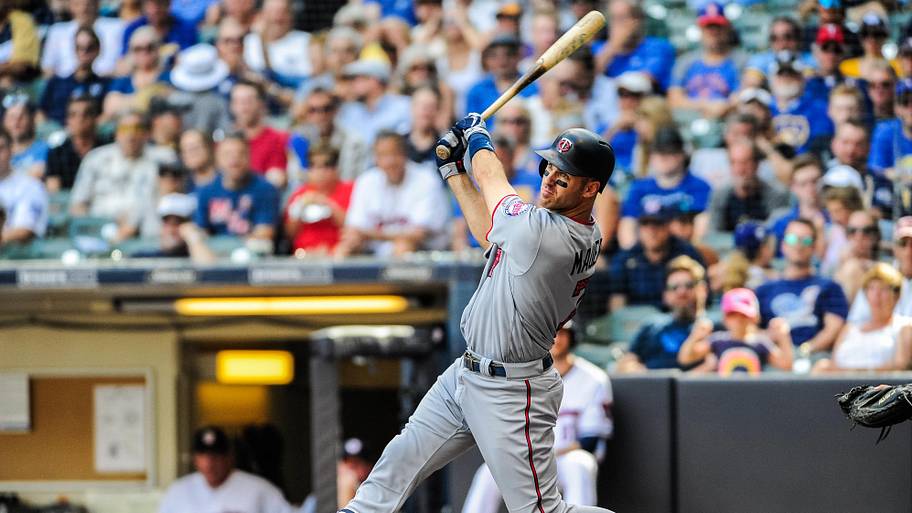 Joe Mauer swing bat against the Milwaukee Brewers