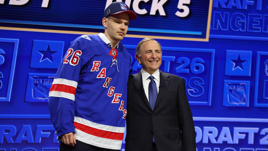 Alberts Smits reacts beside NHL commissioner Gary Bettman after being selected with the fifth pick.