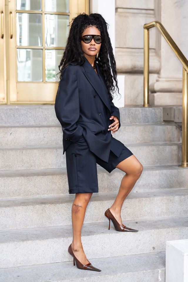 Teyana Taylor posing on a staircase