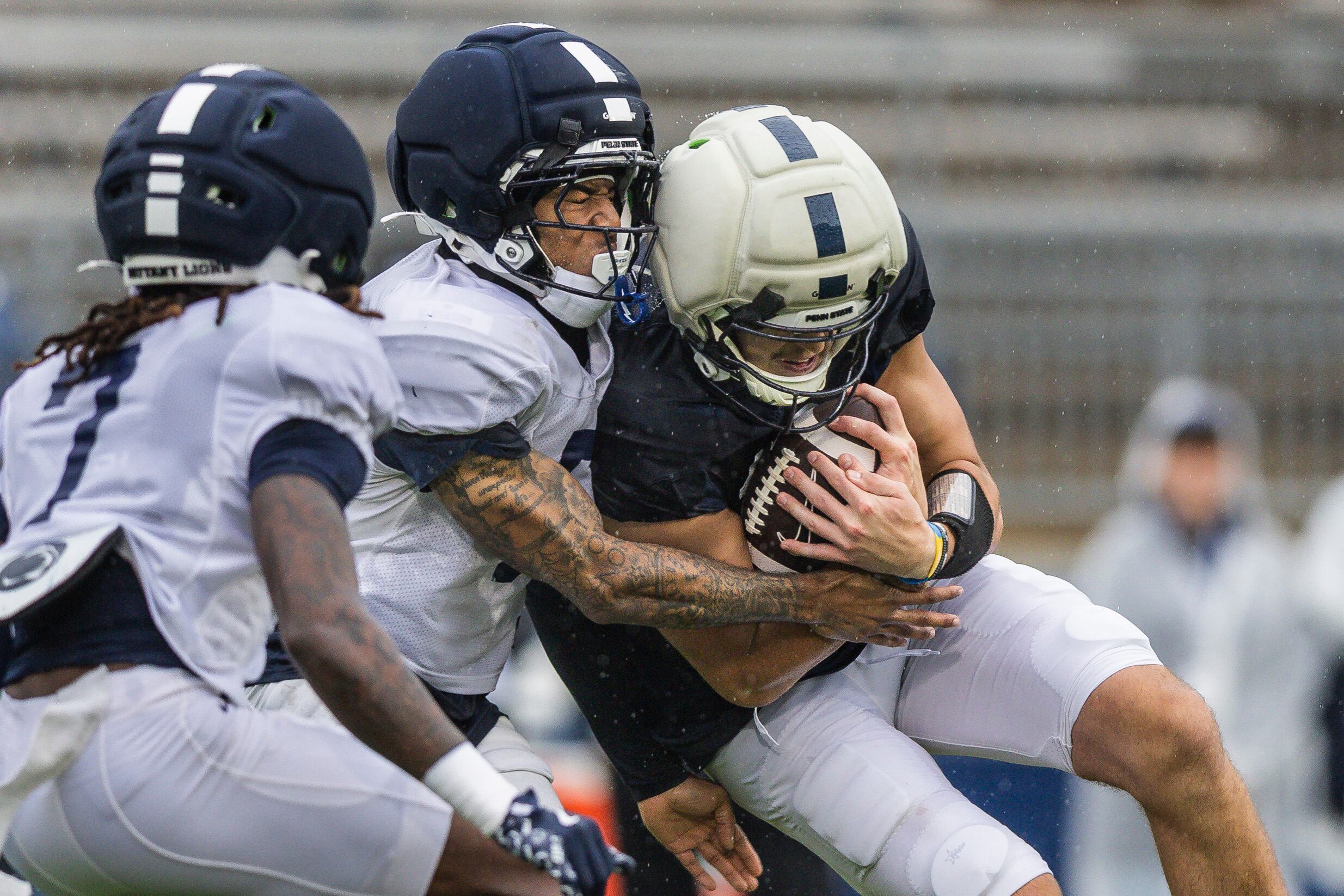 Penn State cornerback Daryus Dixson hits tight end Benjamin Brahmer during the Blue-White practice session at Beaver Stadium on April 25, 2026. Joe Hermitt | jhermitt@pennlive.com