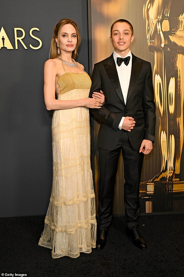 Aside from Pax, Vivienne's twin brother Knox is the only other sibling who has yet to formally drop the actor's surname. Knox and Jolie seen in 2024
