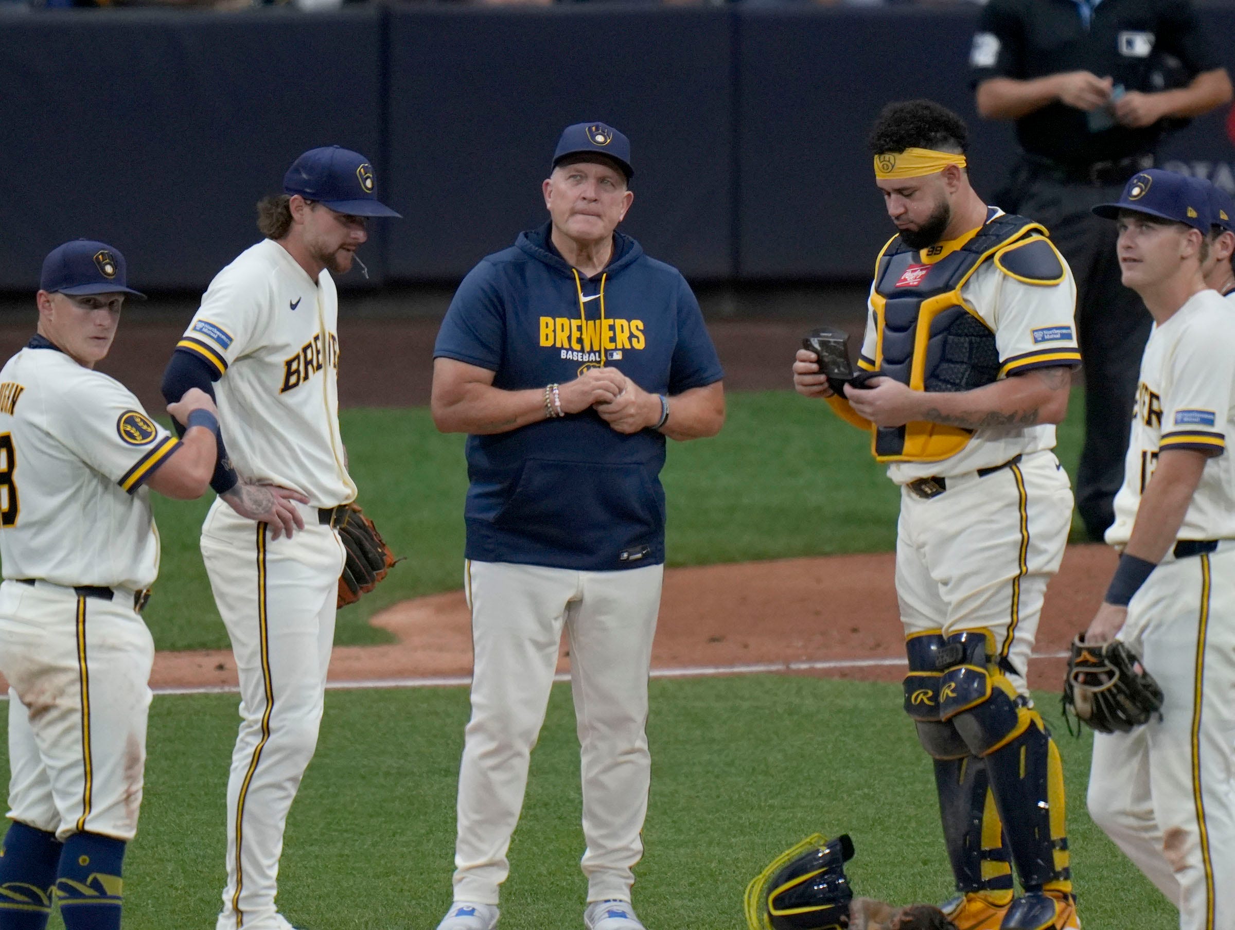 Milwaukee Brewers manager Pat Murphy and players wait for the arrival of reliever Chad Patrick who was replacing Brandon Sprot in the top of the fifth inning against the New York Mets on Tuesday, July 21 at American Family Field.