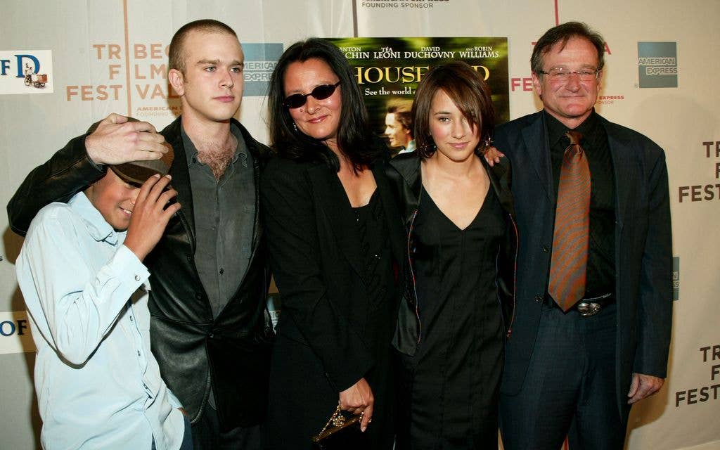 Actor Robin Williams (R) poses with sons Cody and Zack, wife Marsha and daughter Zelda in 2004