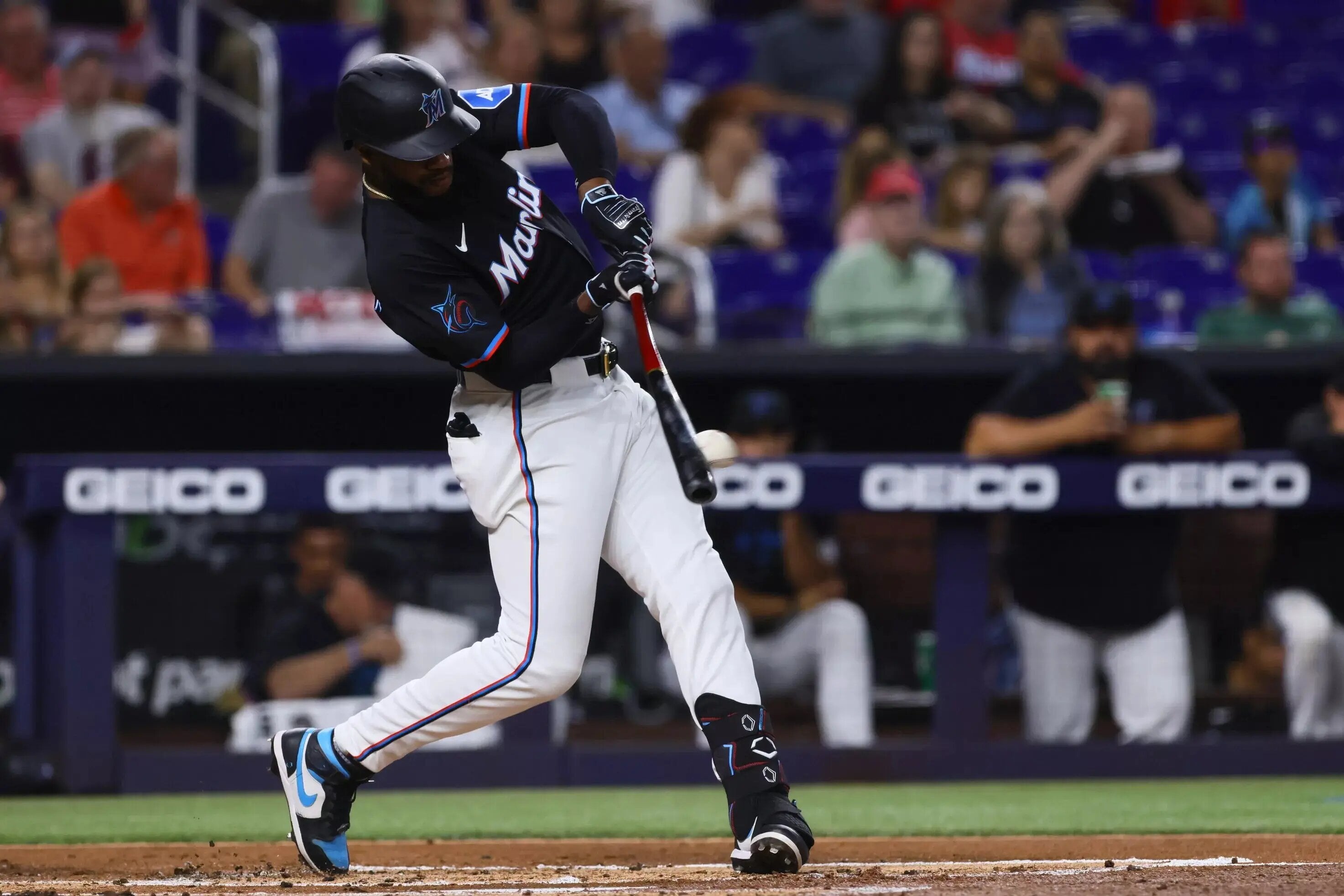 May 10, 2024; Miami, Florida, USA; Miami Marlins left fielder Bryan De La Cruz (14) hits a double against the Philadelphia Phillies during the first inning at loanDepot Park. Mandatory Credit: Sam Navarro-USA TODAY Sports | Source: Lastwordonsports.com - Ben Rosen, Staff Writer