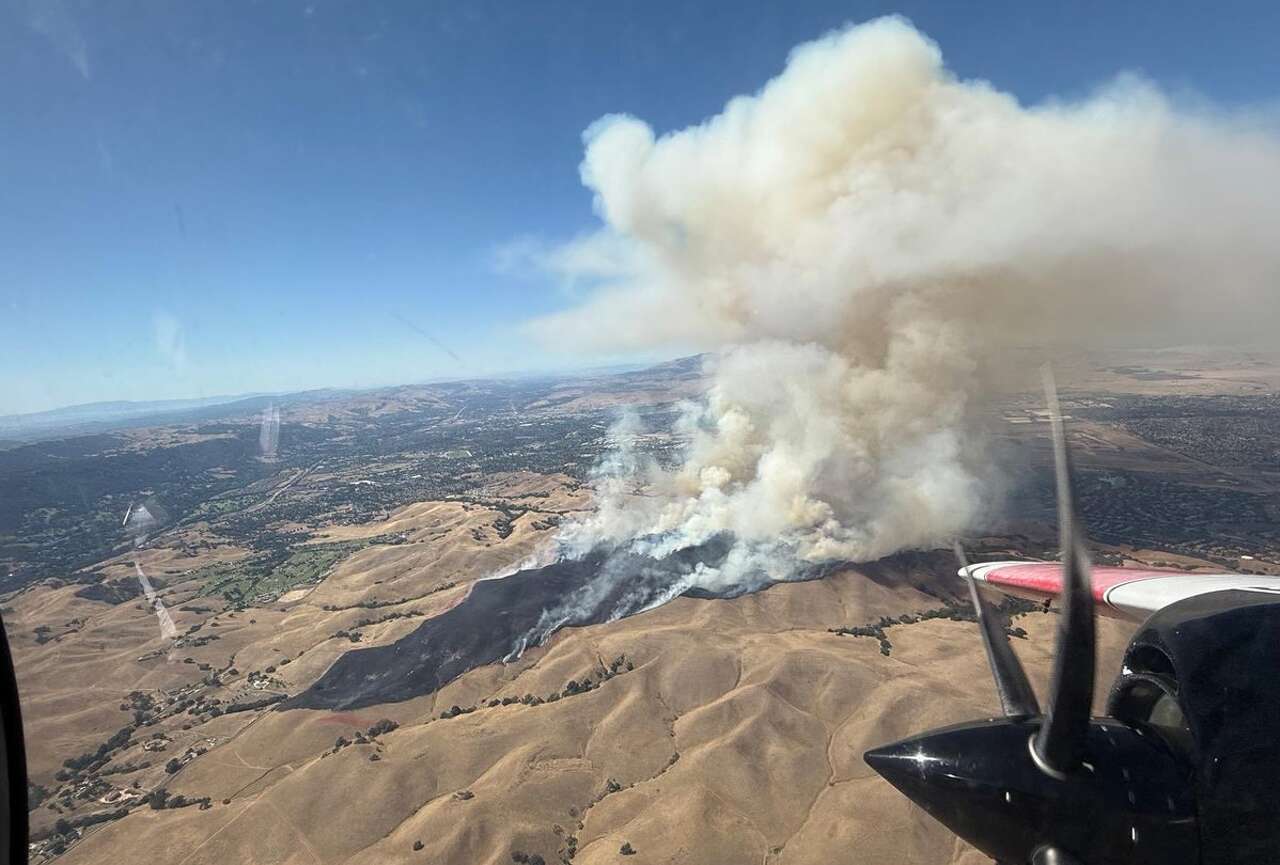 Fast-moving East Bay wildfire near Pleasanton forces evacuations, poses ‘serious threat' to homes