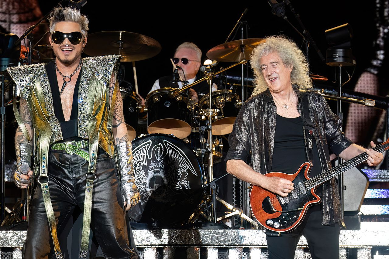 Adam Lambert (L) and British musicians Roger Taylor (C) and Brian May (R) of band Queen + Adam Lambert, perform at the Circuit of the Americas in Austin, Texas, on October 21, 2023.