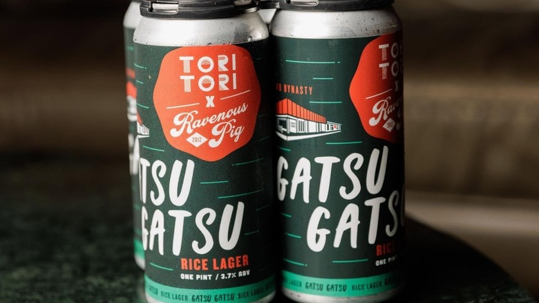 Two cans of Ravenous Pig Gatsu Gatsu Rice Lager