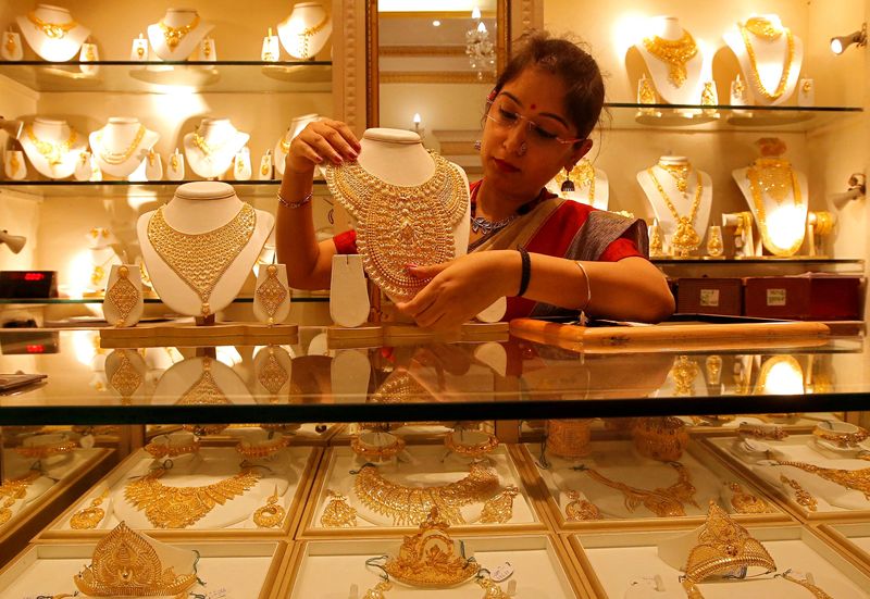 Gold hits two-week high as Fed outlook, Middle East conflict stay in focus