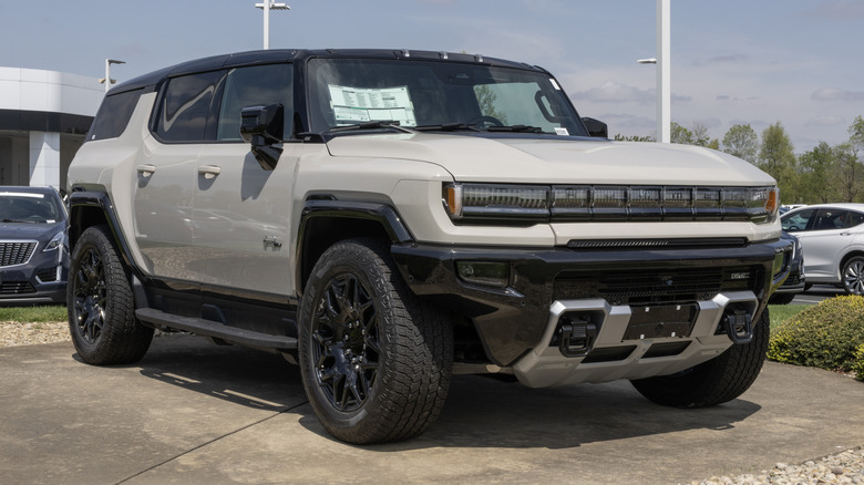 A white GMC Hummer EV 2X electric SUV on display.