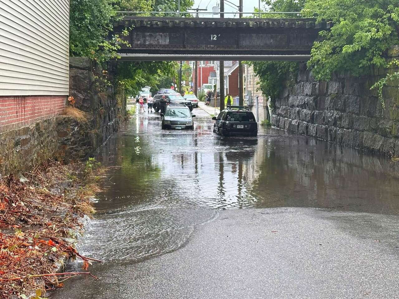 Two rescued in Killingly from car submerged in flood water, officials say