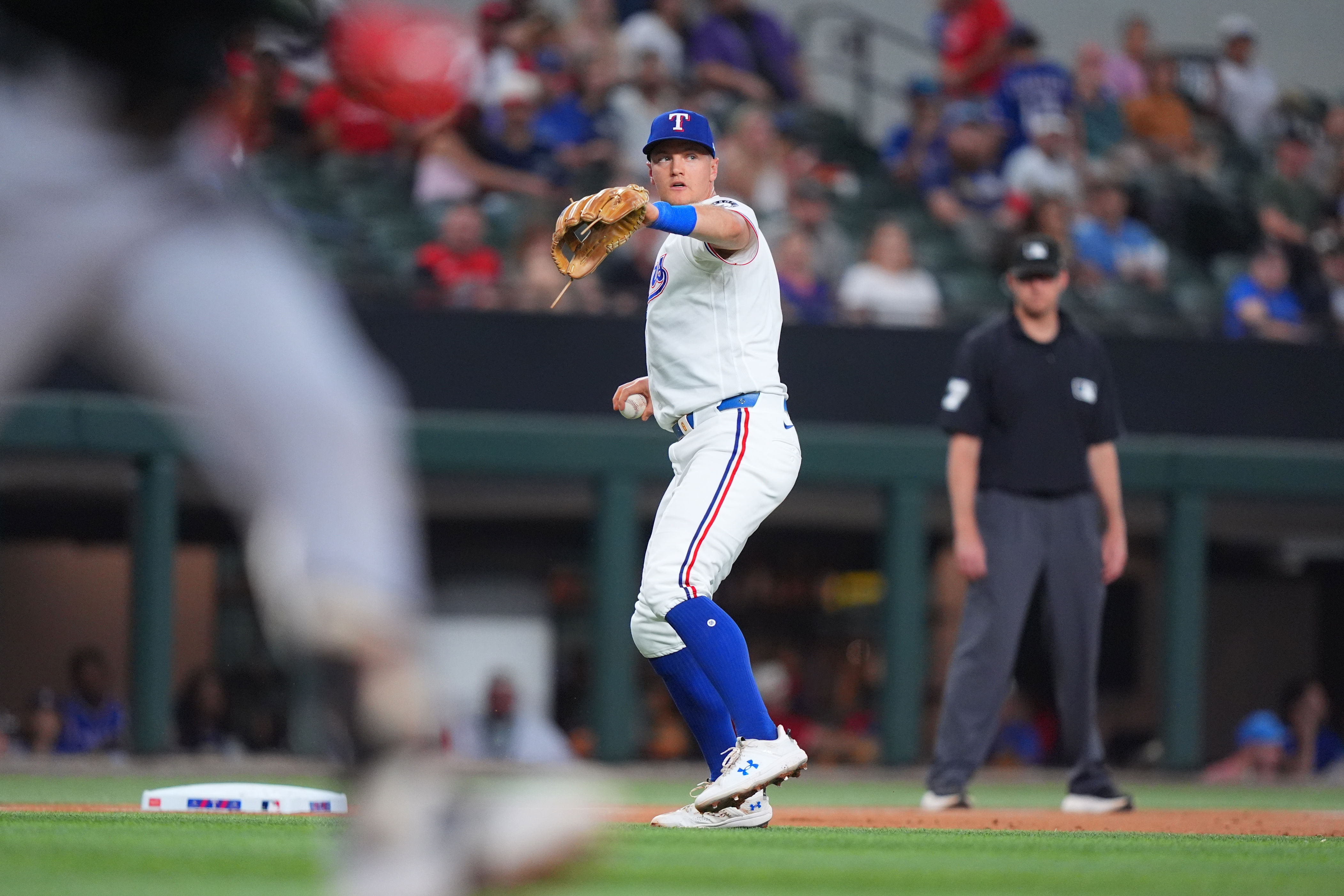 Texas Rangers third baseman Josh Jung throws to first base after fielding a ground out against Chicago White Sox's Chase Meidroth during the second inning of a baseball game, Tuesday, July 21, 2026, in Arlington, Texas. (AP Photo/LM Otero)