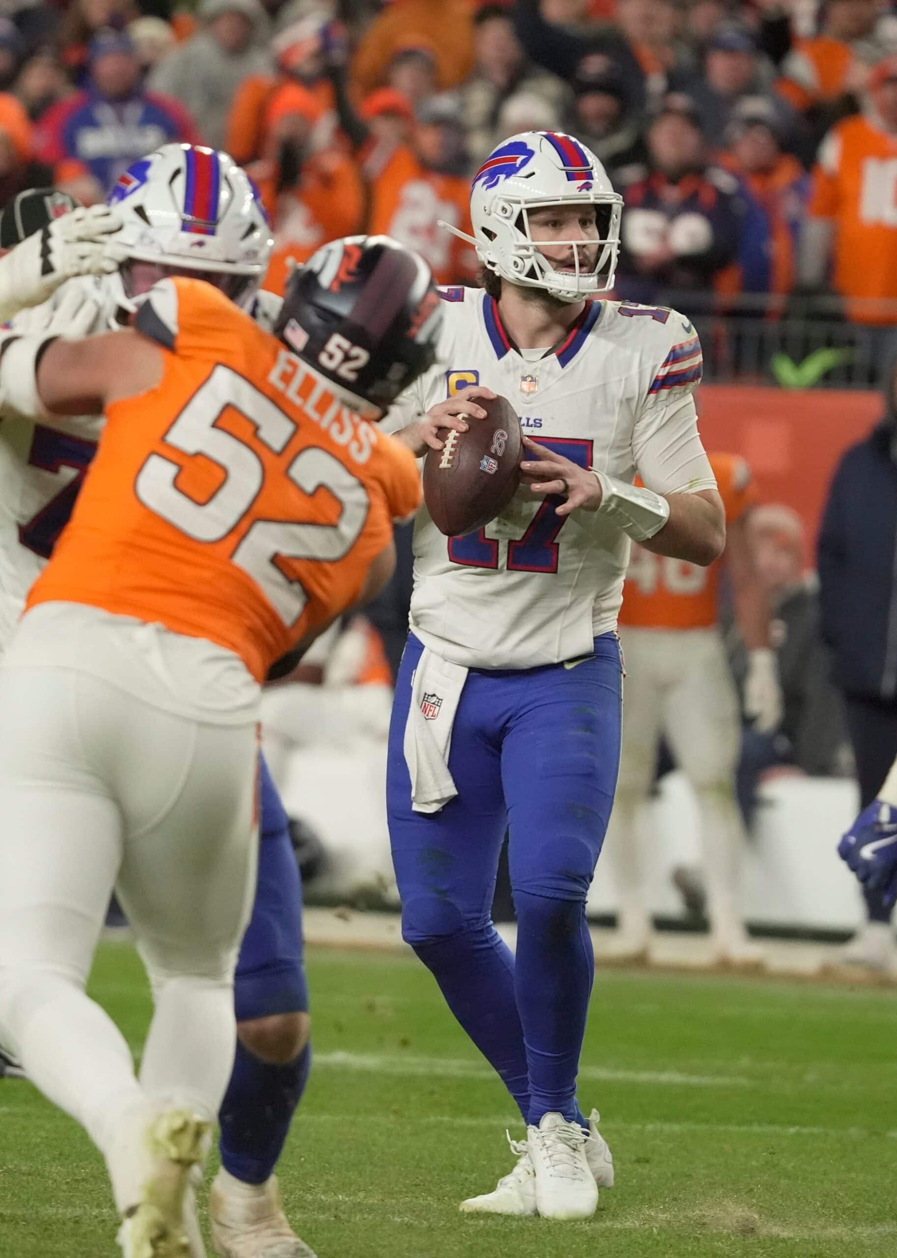 Quarterback Josh Allen looks for a receiver during second half action at Empower Field at Mile High in Denver, Colorado on Jan. 17, 2026.