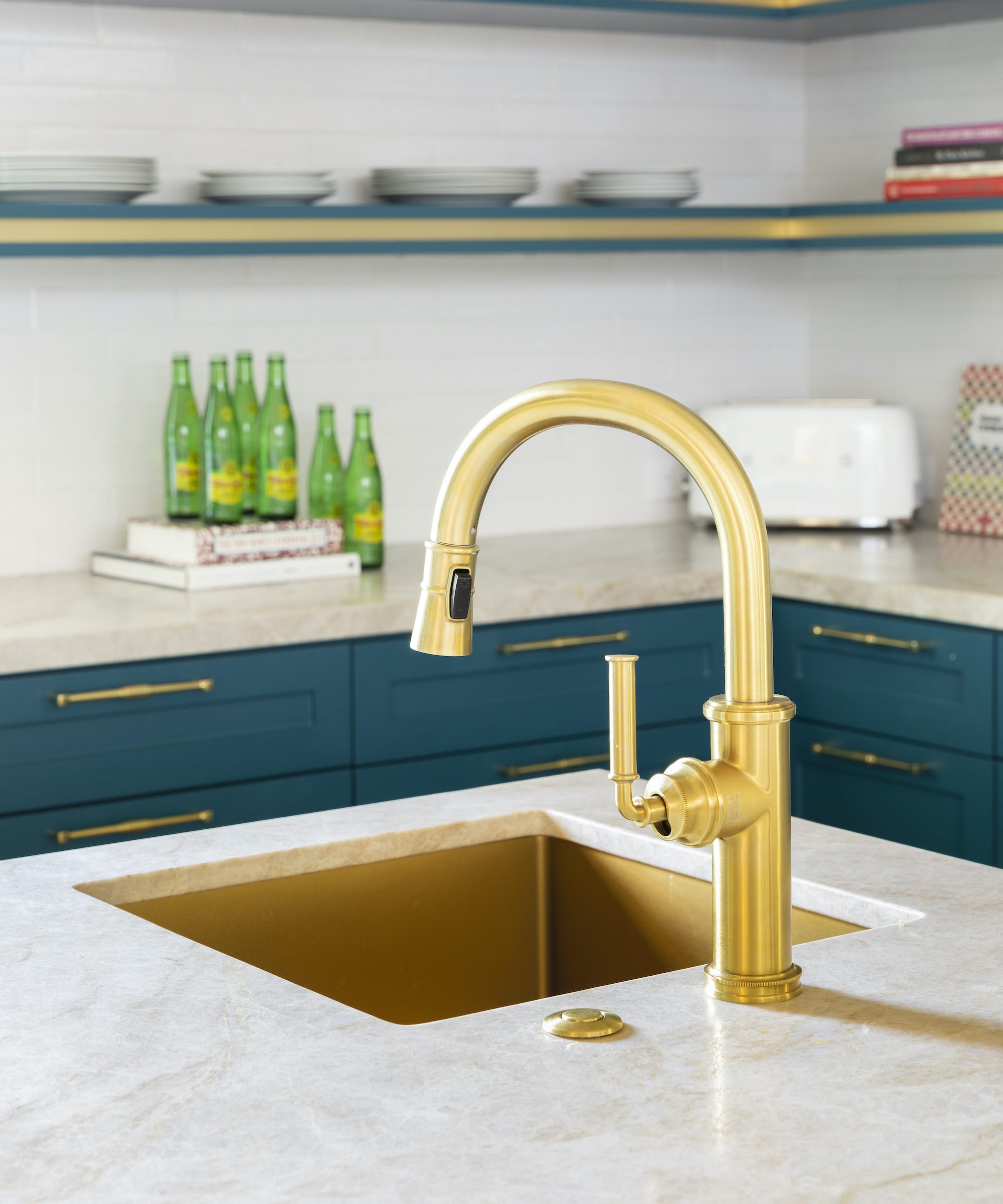 brass sink with brass tap in blue kitchens