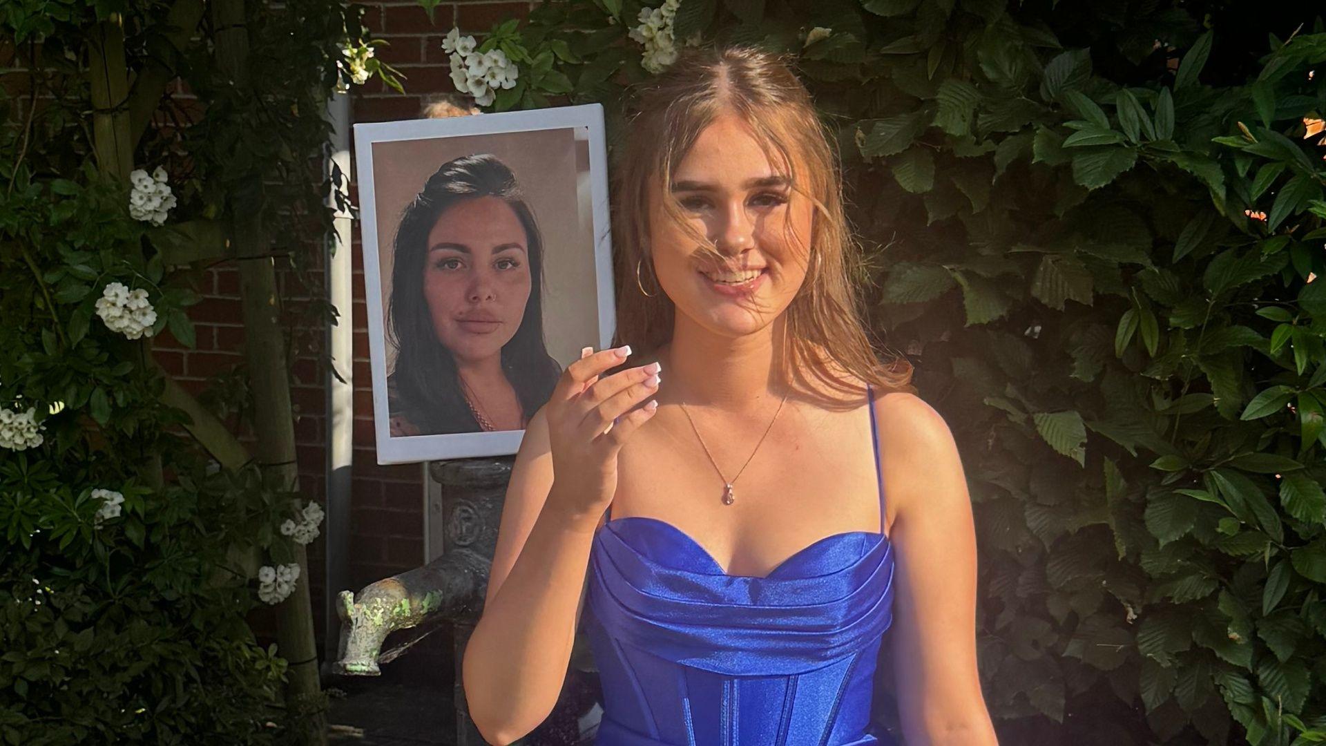 Alice Webb's oldest daughter Delsie holds up a picture of her mum as she gets ready to go to her prom