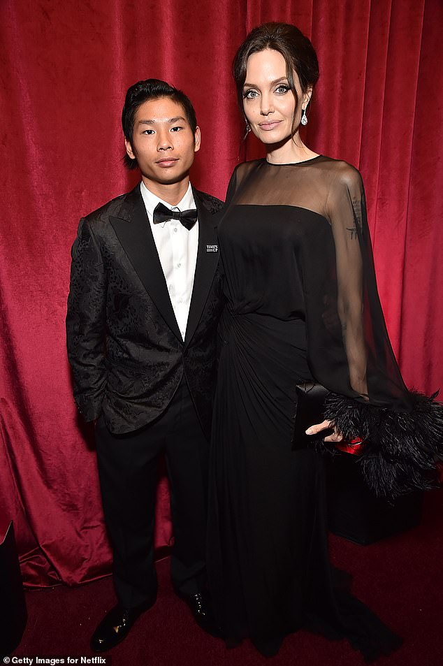 Pitt's relationship with 22-year-old son Pax also remains strained though it is currently unclear if he has taken steps to drop the Pitt name as well. Pictured with Jolie in 2018