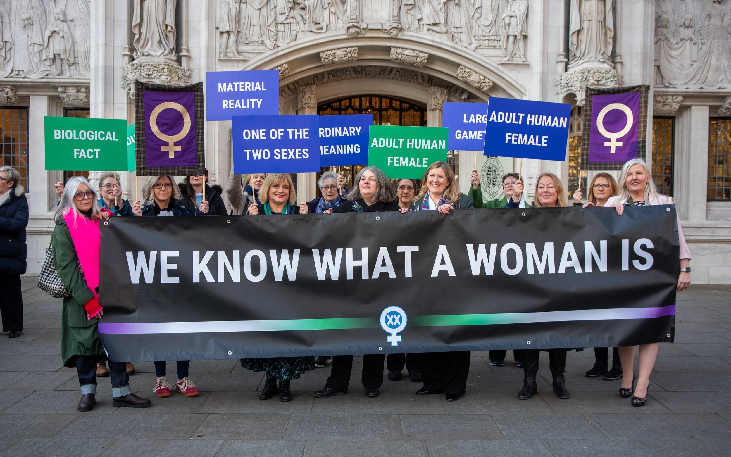 Supporters of Sex Matters and For Women Scotland hold placards outside the Supreme Court