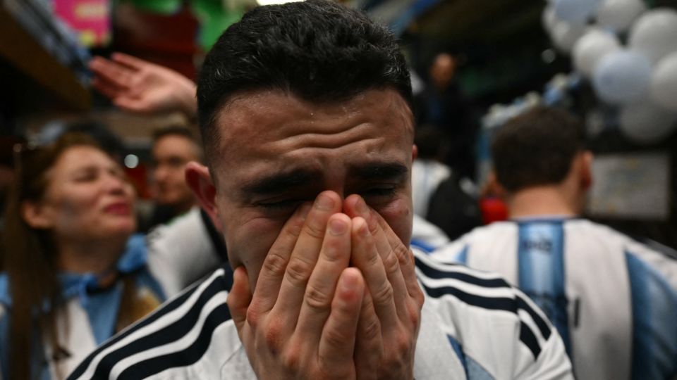 An Argentina fan cries after the end of the FIFA World Cup final match between Spain and Argentina at a bar in Buenos Aires, on July 19. Spain won by 1-0. - Luis Robayo/AFP/Getty Images