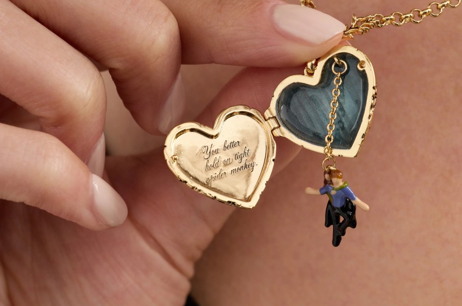 Alex and Ani Twilight spider monkey locket necklace, with a enamel charm of Bella perched on Edward's back