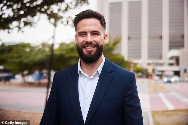 A venture capitalist paid $10,000 for a beard transplant to gain confidence and respect at work. A stock image of a bearded professional in a suit is pictured