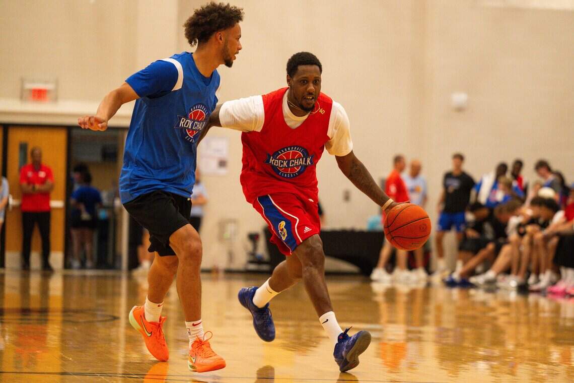 Mario Chalmers dribbles past Zeke Mayo in the Rock Chalk Roundball Classic, Thursday, June 4, 2026, in Lawrence.