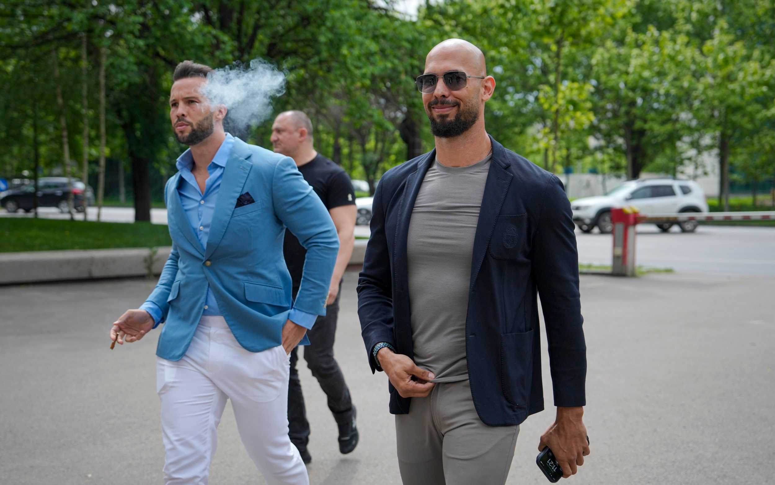 Tristan and Andrew Tate arrive at the Bucharest Tribunal in Romania in 2024