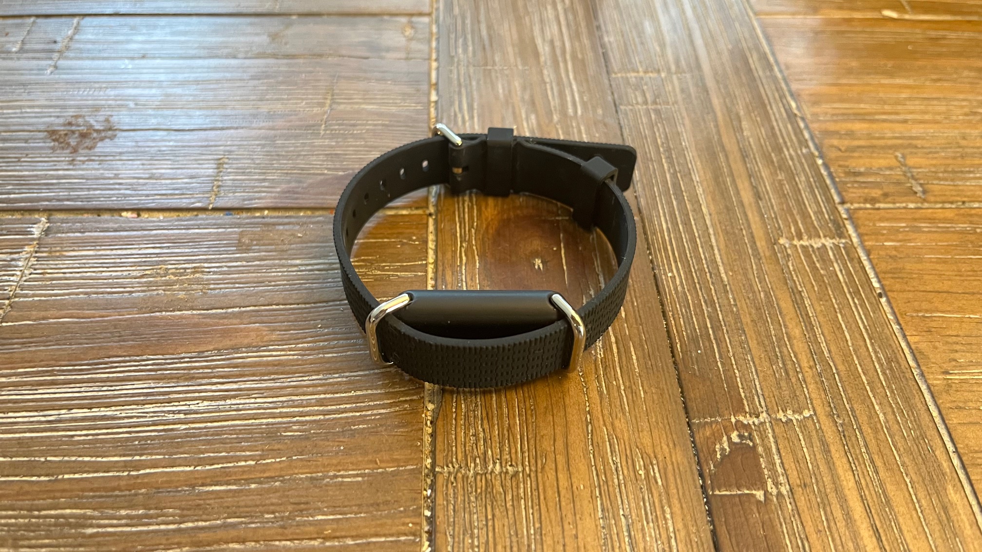 The Hilo band on a wood surface.