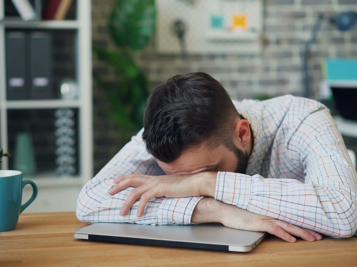 Man slumped at desk