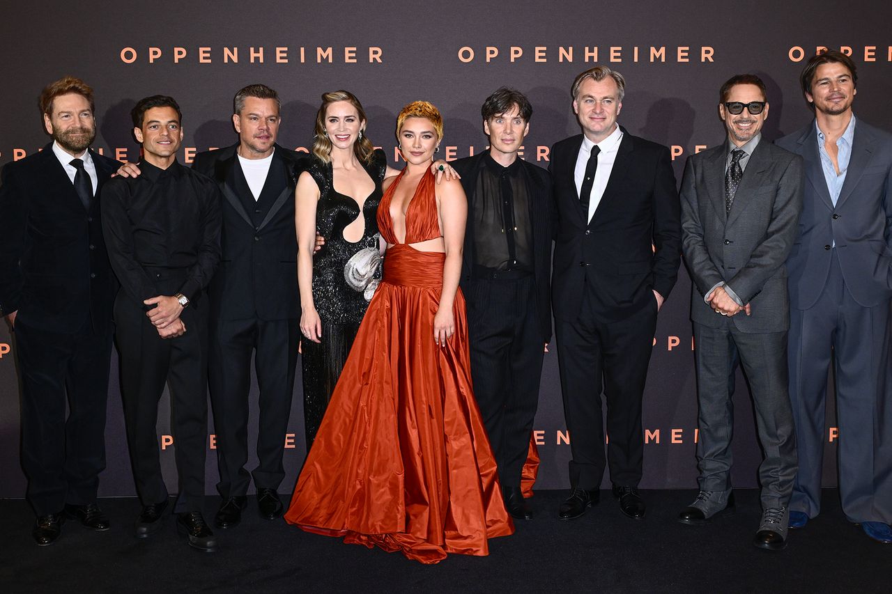 Kenneth Branagh Robert Downey Jr Christopher Nolan Josh Hartnett Matt Damon Rami Malek and Cillian Murphy posing together at an event