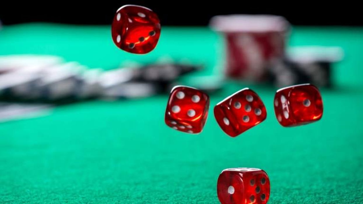 'Rolling casino dice' (Shutterstock)