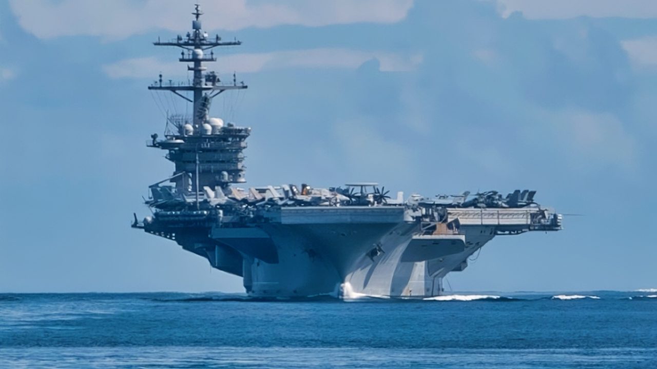 SIBUTU PASSAGE (Feb. 6, 2025) – The Nimitz-class aircraft carrier USS Carl Vinson (CVN 70), left, and the Ticonderoga-class guided-missile cruiser USS Princeton (CG 59) transit the Sibutu Passage Feb. 6, 2025. The Carl Vinson Carrier Strike Group is underway conducting routine operations in the U.S. 7th Fleet area of operations. (U.S. Navy photo by Mass Communication Specialist 3rd Class Brianna Walker)