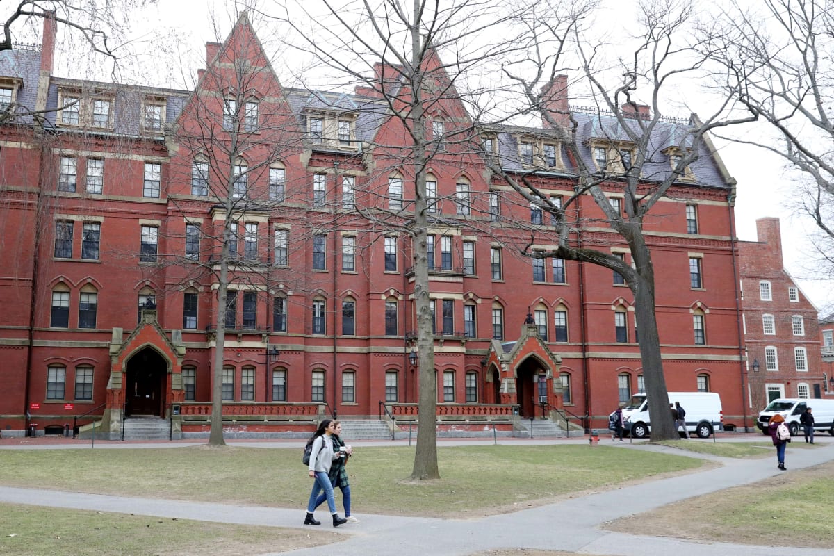 CAMBRIDGE, MASSACHUSETTS - MARCH 12: Students walk through Harvard Yard on the campus of Harvard Uni