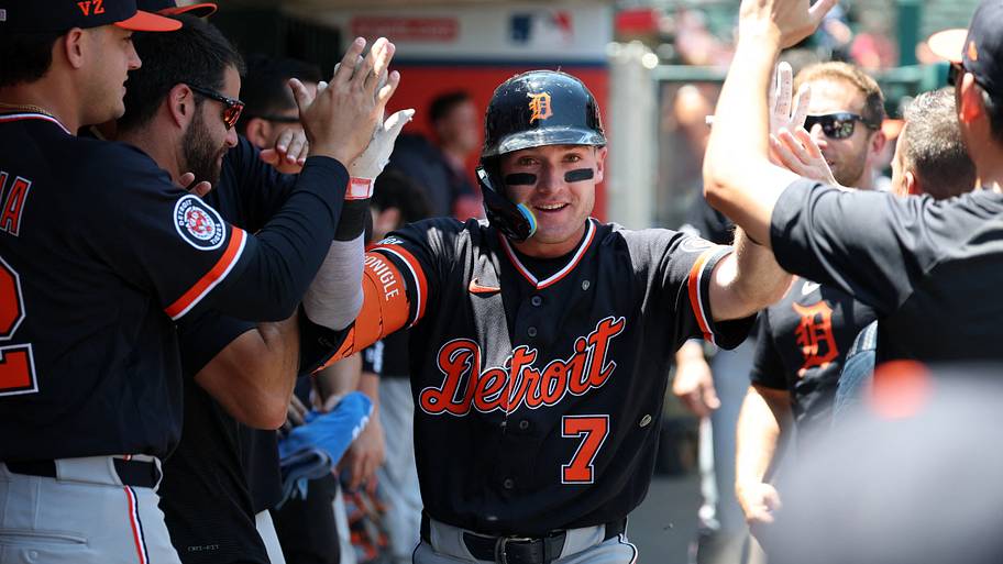 Detroit Tigers shortstop Kevin McGonigle celebrates with his teammates in the dugout after scoring.