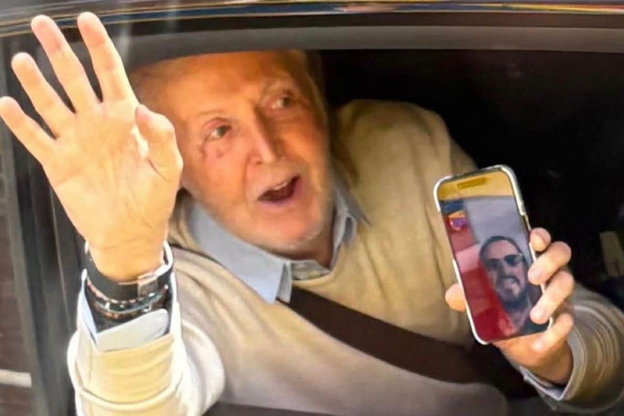 Sir Paul McCartney surprises Beatles fans by waving from his car while on a FaceTime call with fellow Beatle Ringo Starr in Liverpool.