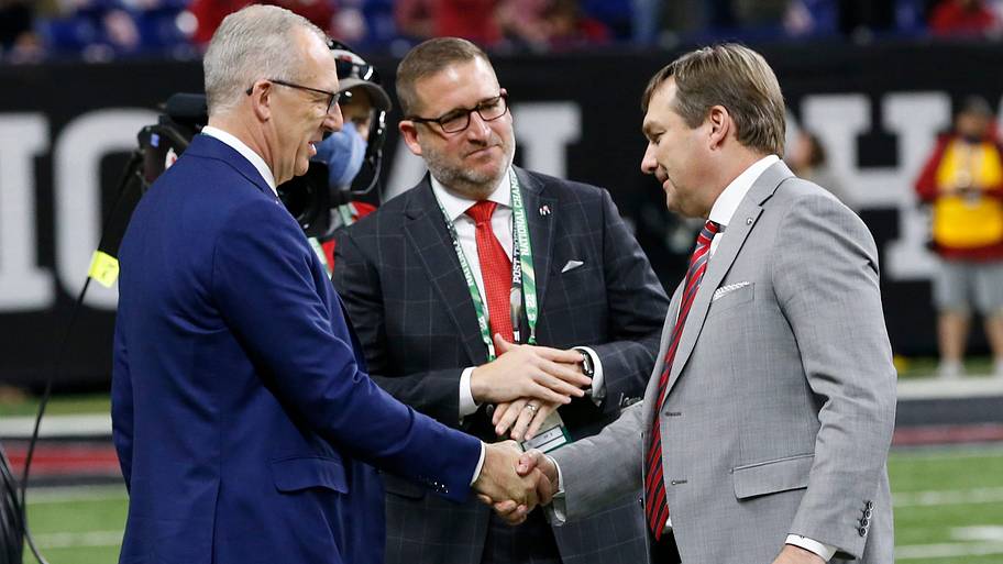 SEC commissioner Greg Sankey shakes hands with Georgia coach Kirby Smart