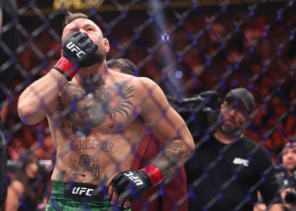 Conor McGregor reacts after losing in first round due to injury of UFC 329 fight against Max Holloway