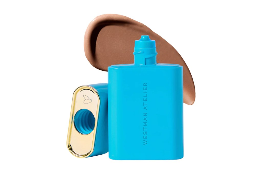 Westman Atelier foundation drops in a blue bottle with a swatch of product.