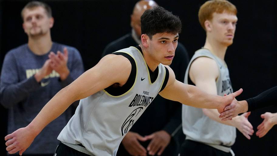 Purdue Boilermakers guard Omer Mayer (17) gets a high five.